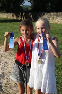 Liana Lara and Gloria Hannah both win first place in the girls foot races at the end of school party hosted by Gwen Shamblin Lara and Joe Lara.